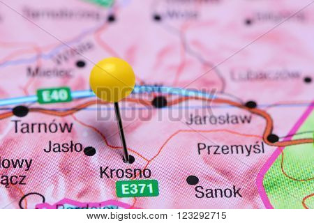 Photo of pinned Krosno on a map of Poland. May be used as illustration for traveling theme.