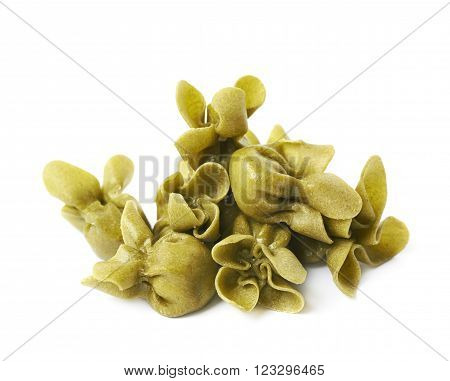 Pile of sacchettoni stuffed sacchetti pasta isolated over the white background