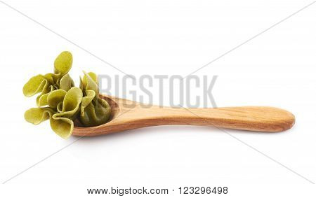 Wooden spoon full of sacchettoni stuffed pasta isolated over the white background