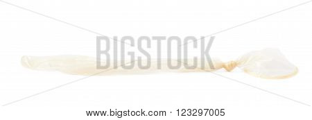Used lated condom isolated over the white background