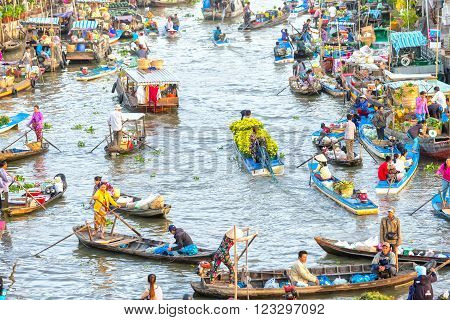 Soc Trang, Vietnam - February 3rd, 2016: Boat carrying daisies trade on the river at the end of the year around is the busiest boats agricultural trade makes the scene more beautiful countryside in Soc Trang, Vietnam