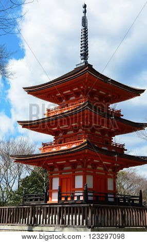 Small three story pagoda in traditional Buddhist style at Kiyomizu-dera historical site in Kyoto