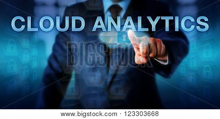 Information technology leader is touching CLOUD ANALYTICS on a virtual interface. Information technology concept and business strategy metaphor for efficient cloud computing resource utilization.