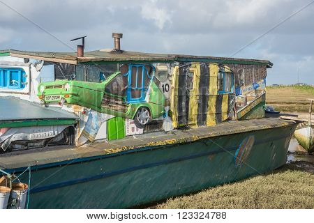 Shoreham-on-Sea ,UK - February 6 2016: Old barge converted into a house boat with part of a car built into the design