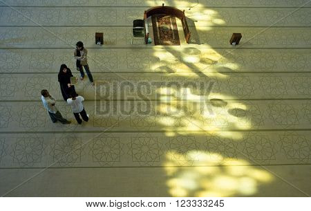 Manama, Bahrain - December 9 2006: Visitors in the Al Fateh Mosque also know as Great Mosque