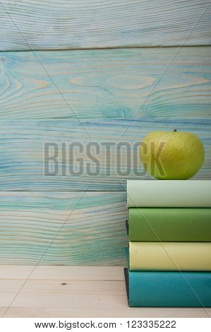 Back to school. Stack of colorful books on wooden table. Composition with vintage old hardback books, diary on wooden deck table. Books stacking. Copy Space. Education background.
** Note: Soft Focus at 100%, best at smaller sizes