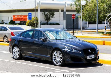 SANTIAGO, CHILE - NOVEMBER 24, 2015: Modern sports car Jaguar XF-R in the city street.