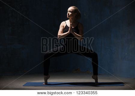 Beautiful Yoga Woman Standing In Sumo Squat Pose