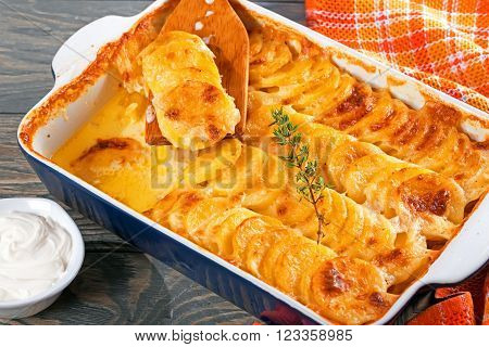 Au Gratin Dauphinois Potatoes baked in a baking dish close-up