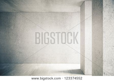 Sunlit interior with blank concrete wall and floor. Mock up