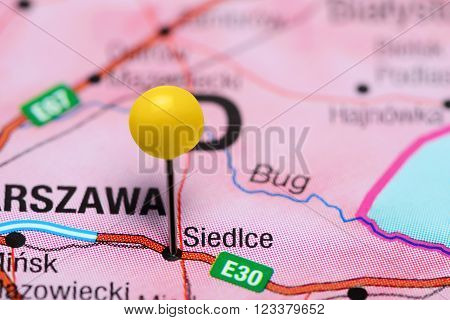 Photo of pinned Siedlce on a map of Poland. May be used as illustration for traveling theme.