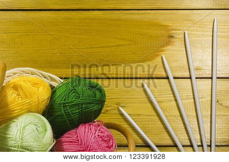 The inverted pad with the different colored threads and spokes for knitting