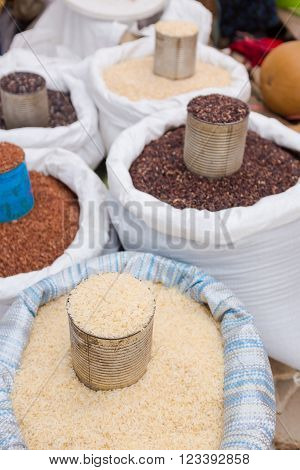 various types of raw rice selling in the market