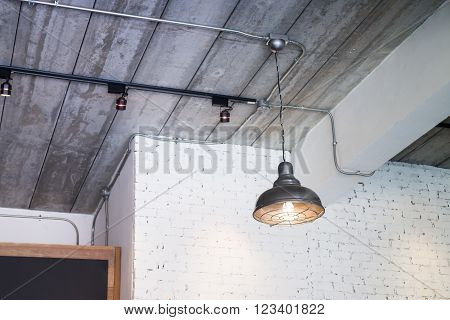 Black ceiling lamp in the room stock photo