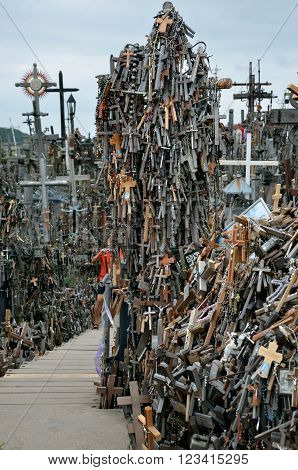 Cca 12 km north of the city of SIAULIAI / LITHUANIA - July 24 2013: Close view of the Hill of Crosses a place of worship for Christians