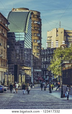 Bucharest, Romania - October 6, 2013: Tourists wander the cobblestone streets of the historic center Lipscani, the Bucharest's liveliest entertainment district.