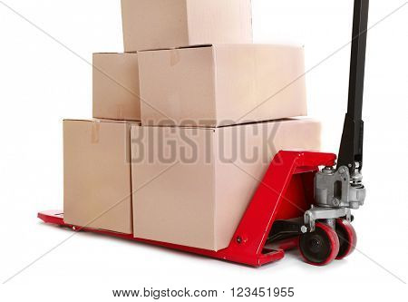 Fork pallet truck with stack of cardboard boxes isolated on white