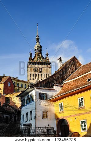 Medieval City Of Sighisoara With Clock Tower, In A Warm Summer Morning, Romania