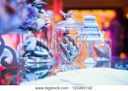 eco-friendly French makarons cake on the table. With purple lighting
