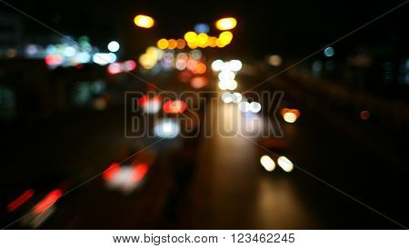 Night blur city road curved, abstract bokeh lights background