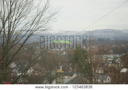 The city of Torrington Connecticut in the hills of the northwest corner during early spring on a rainy misty morning.