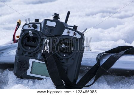 Remote Control For Quadrocopter Unmanned Aerial Vehicle In Snow In Their Hands.