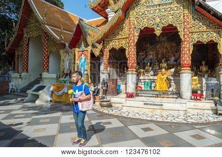 CHIANG MAI, THAILAND - FEBRUARY 5: Thai people worship at Wat Phra That Doi Suthep on February 5, 2016 in Chiang Mai. This Buddhist temple founded in 1383 is the most famous in Chiang Mai.