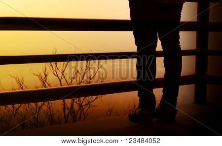 Backside Of Women Leg On Balcony And Highland View Blurred Background