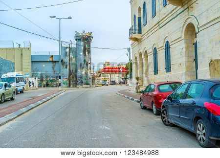 BETHLEHEM, PALESTINE - FEBRUARY 18, 2016: The damaged tower of separation wall in Bethlehem on February 18 in Bethlehem.