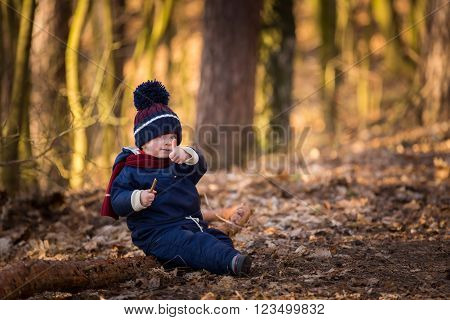 Caucasian Boy Playing Outdoor At Springtime