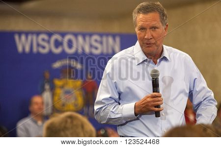 MADISON WI/USA - March 28 2016: Republican presidential candidate John Kasich speaks to a group of supporters during a town hall event before the Wisconsin presidential primary in Madison Wisconsin.