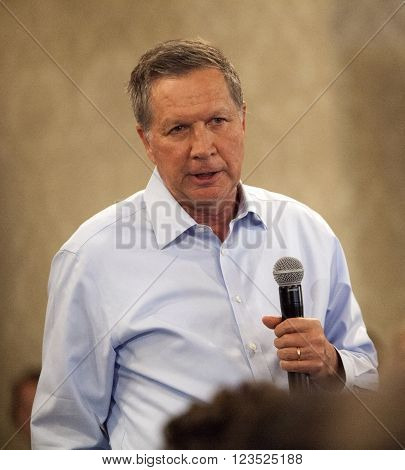 MADISON WI/USA - March 28 2016: Republican presidential candidate John Kasich speaks to a group of supporters during a town hall event before the Wisconsin presidential primary in Madison Wisconsin.