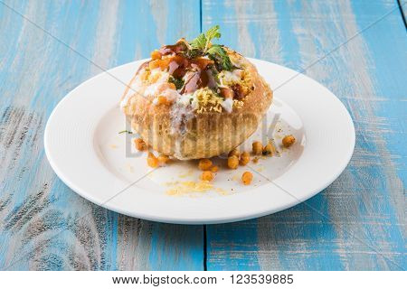 Rajasthani Shahi Raj Kachori, stuffed katchori with potato and sprout filling and served with curd, chutney and sev