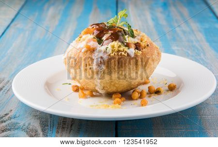 Rajasthani Shahi Raj Kachori, stuffed katchori with potato and sprout filling and served with curd, chutney and sev