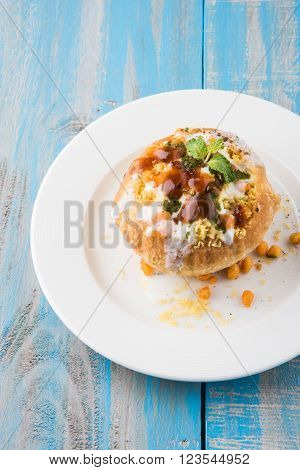Rajasthani Shahi Raj Kachori, stuffed katchori with potato and sprout filling and served with curd, chutney and sev