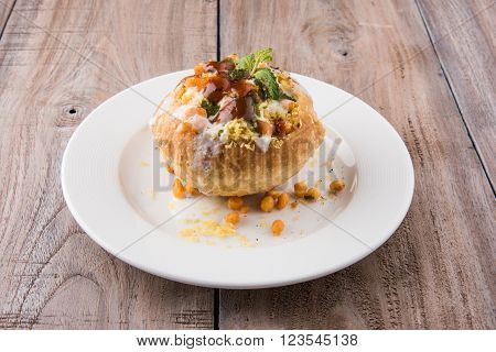 Rajasthani Shahi Raj Kachori, stuffed katchori with potato and sprout filling and served with curd, chutney and sev