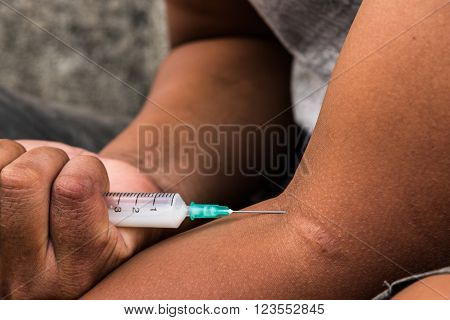 Teenager hand with heroin syringe closeup, narcotic drugs addiction concept
** Note: Soft Focus at 100%, best at smaller sizes