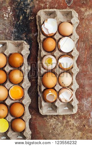 Baking cake ingredients - bowl flour eggs egg whites foam eggbeate on wood chalkboard from above. Cooking course or kitchen mess poster concept. Flat lay. Rustic style