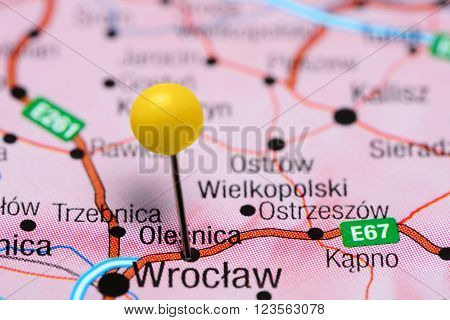 Photo of pinned Olesnica on a map of Poland. May be used as illustration for traveling theme.