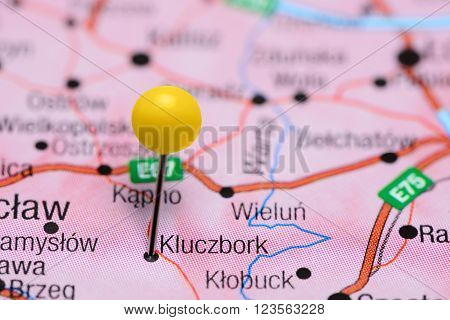 Photo of pinned Kluczbork on a map of Poland. May be used as illustration for traveling theme.