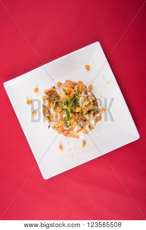 Rajasthani Shahi Raj Kachori, stuffed katchori with potato and sprout filling and served with curd, chutney and sev
