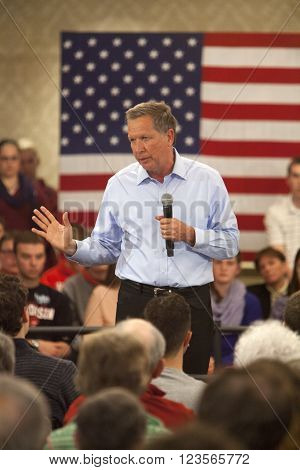 MADISON WI/USA - March 28 2016: Republican presidential candidate John Kasich speaks to a group of supporters during a town hall event before the Wisconsin presidential primary in Madison Wisconsin.
