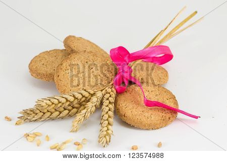 Integral Cookies And Wheat Plant On White Baclground