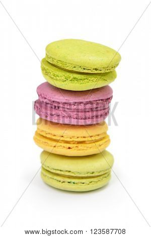 French colorful macarons isolated on white. Tasty, diet, gourmand, delicious.