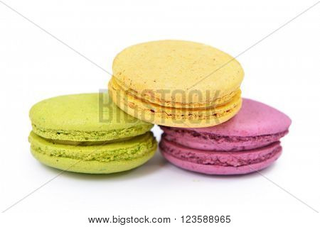 French colorful macarons isolated on white. Tasty, diet, gourmand, delicious.