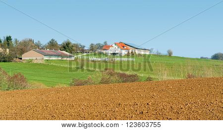 idyllic farm and farmland seen in Southern Germany