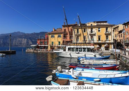 Malcesine, Italy - March 17, 2016: View of Malcesine town center and small port. Malcesine is located on the eastern shore of Lake Garda in the Province of Verona in the Italian region Veneto