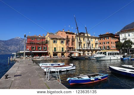 Malcesine, Italy - March 17, 2016: View of Malcesine town center and small port. Malcesine is located on the eastern shore of Lake Garda in the Province of Verona in the Italian region Veneto