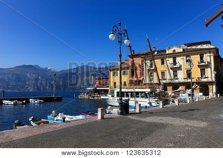 Malcesine, Italy - March 17, 2016: View of Malcesine town center and small port. Malcesine is located on the eastern shore of Lake Garda in the Province of Verona in the Italian region Veneto