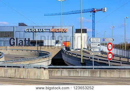 Wallisellen, Switzerland - 26 March, 2016: Glatt shopping center building, view from the motorway bridge on the Neue Wintertuhrestrasse street. Glatt shopping center (German: Einkaufszentrum Glatt or Glattzentrum) is a shopping mall opened in 1975.